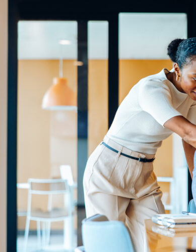 Insurance broker working at a desk reviewing case submissions, illustrating how Word & Brown's back-office support and carrier escalation services save independent agents time